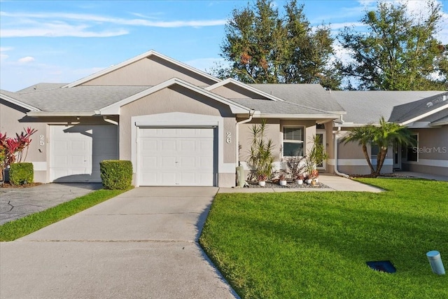 ranch-style home featuring a front lawn and a garage