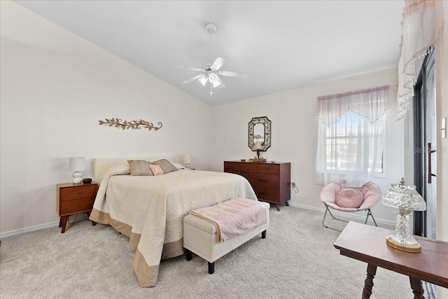 carpeted bedroom with ceiling fan and lofted ceiling