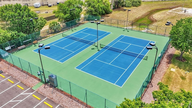 view of tennis court featuring basketball court