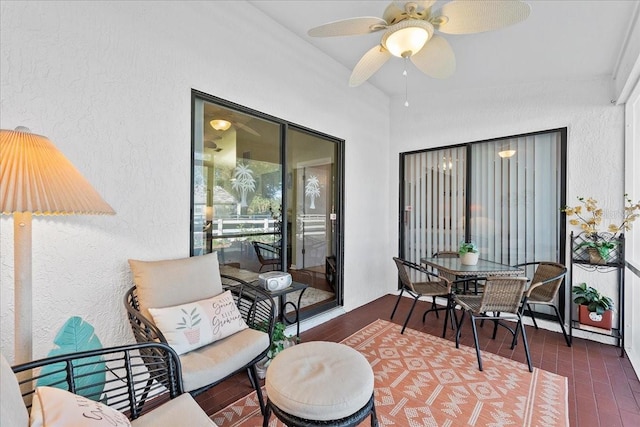 sunroom featuring ceiling fan and lofted ceiling