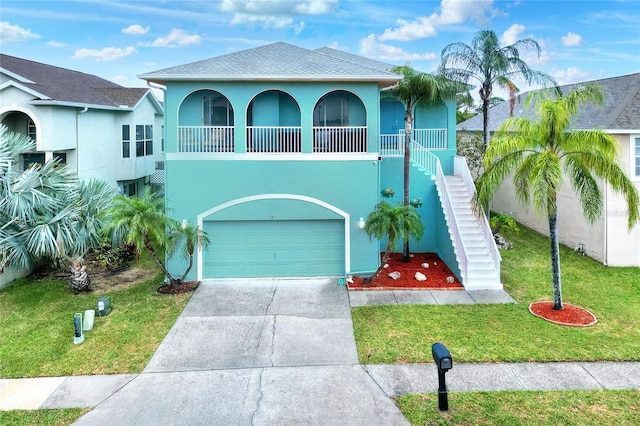 view of front facade with a front yard and a garage