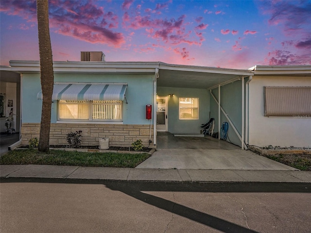 view of front of home featuring a carport