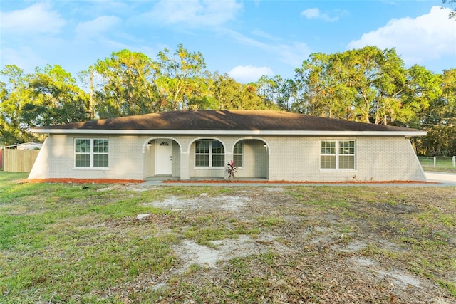 ranch-style house with a front lawn