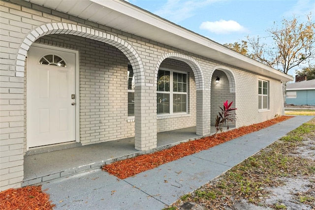 doorway to property featuring a porch