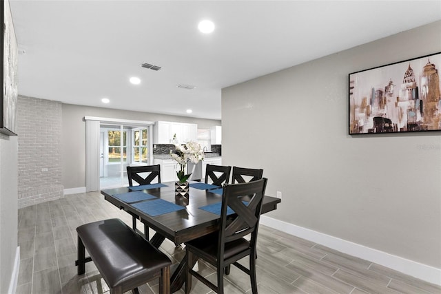 dining space featuring light hardwood / wood-style floors