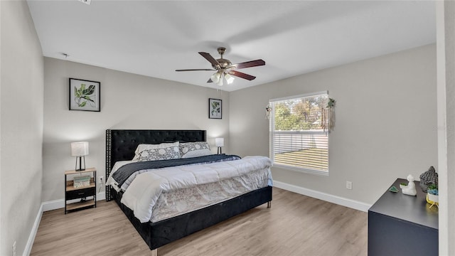 bedroom featuring ceiling fan and light hardwood / wood-style flooring