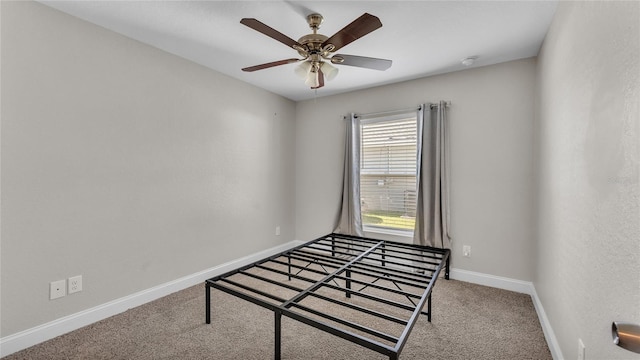 bedroom featuring light carpet and ceiling fan