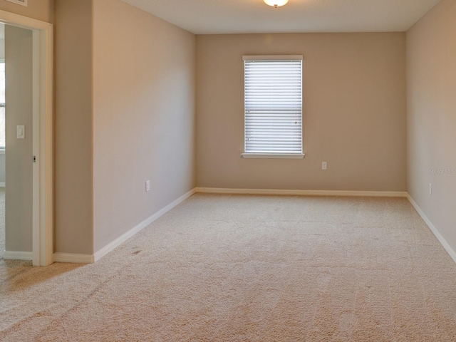 spare room with light carpet