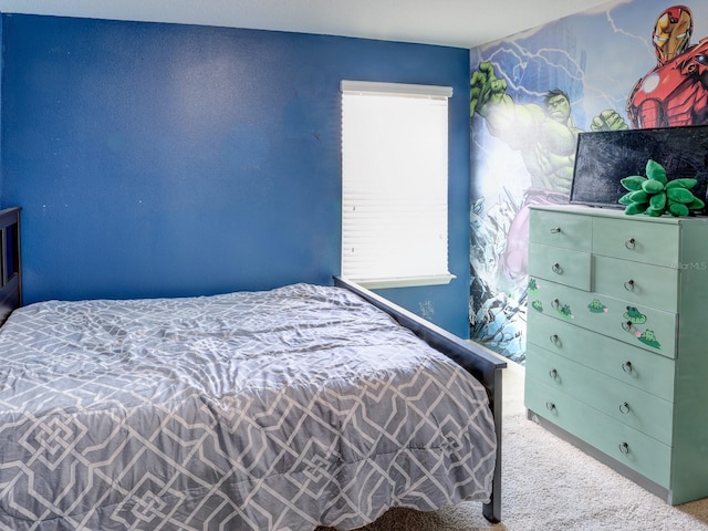 bedroom featuring light colored carpet