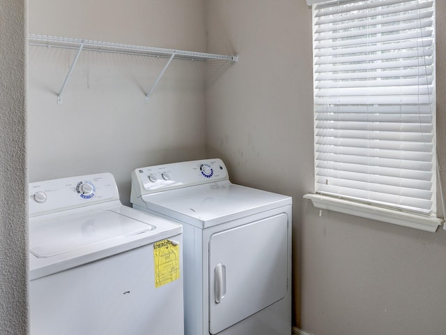 laundry area with separate washer and dryer