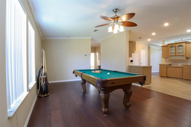 playroom with hardwood / wood-style flooring, ornamental molding, and a wealth of natural light