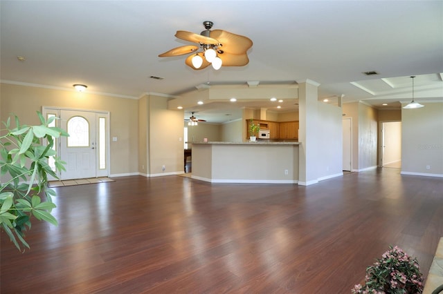 unfurnished living room with ornamental molding, dark hardwood / wood-style floors, and ceiling fan