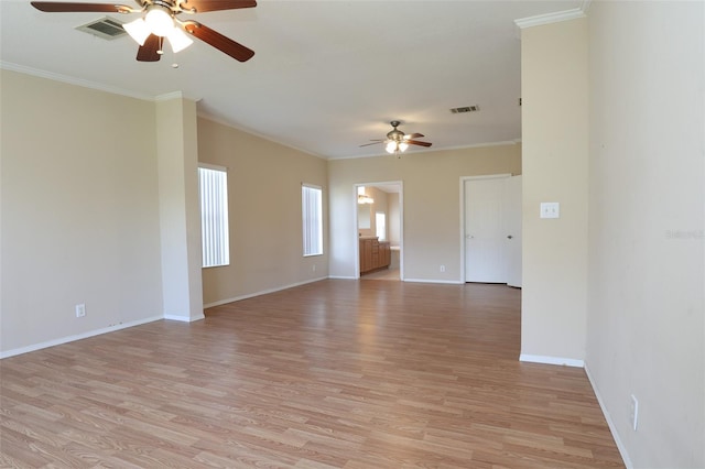 unfurnished room featuring crown molding, ceiling fan, and light wood-type flooring