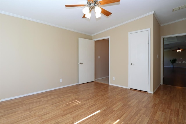 unfurnished bedroom featuring crown molding, ceiling fan, and light wood-type flooring