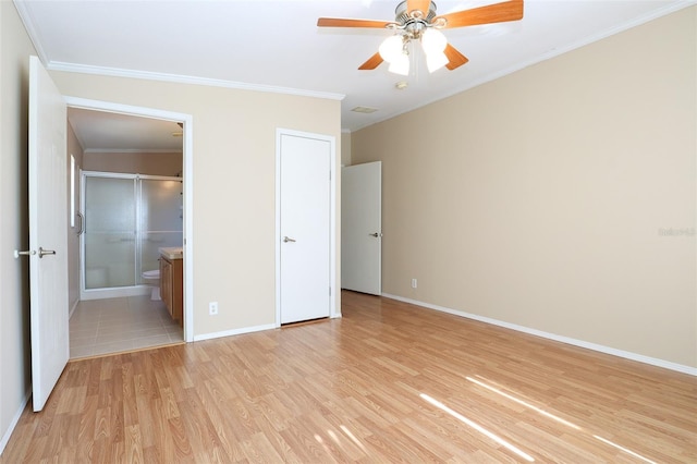 unfurnished bedroom featuring ornamental molding, a closet, ceiling fan, and light hardwood / wood-style flooring