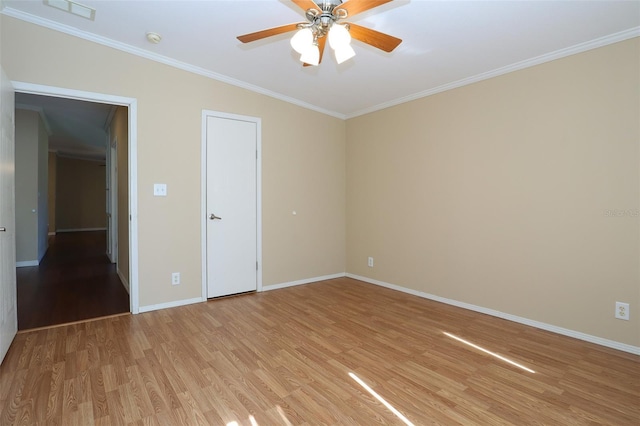 unfurnished bedroom with ornamental molding, ceiling fan, and light hardwood / wood-style flooring