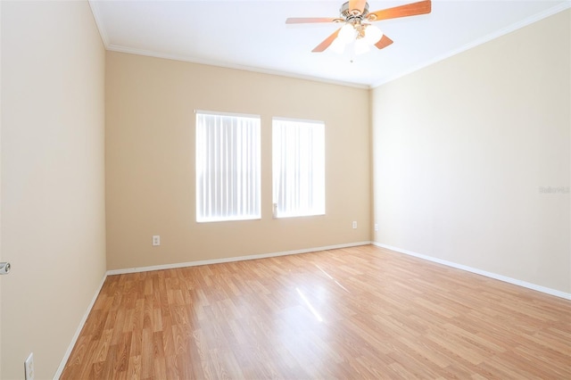 spare room featuring ceiling fan, ornamental molding, and light wood-type flooring