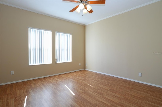 spare room featuring ornamental molding, ceiling fan, and light hardwood / wood-style floors