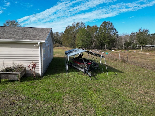 view of yard featuring a carport