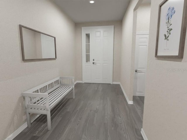 hallway with dark hardwood / wood-style flooring