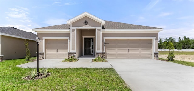 715 SW 77th Cir, Ocala, FL 34474 - view of front facade featuring a garage, stone siding, and stucco siding