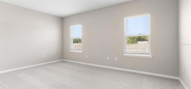 715 SW 77th Cir, Ocala, FL 34474 - empty room featuring light carpet and baseboards