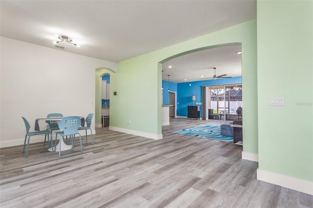 interior space with light hardwood / wood-style floors and ceiling fan