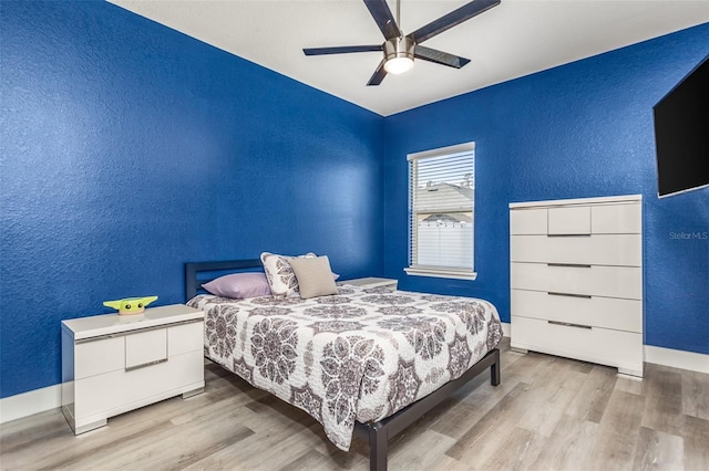 bedroom featuring light hardwood / wood-style floors and ceiling fan