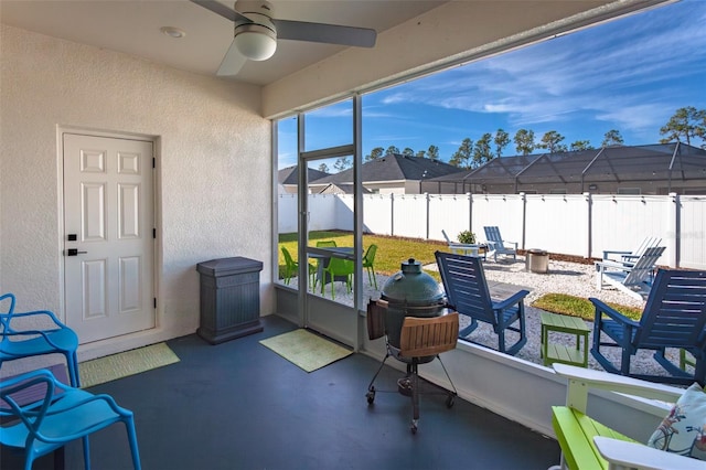 sunroom / solarium with ceiling fan