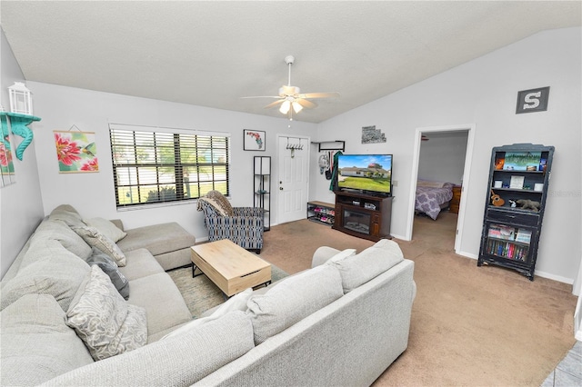 living room featuring ceiling fan, light colored carpet, and lofted ceiling