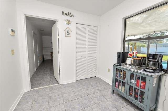 interior space with light tile patterned floors