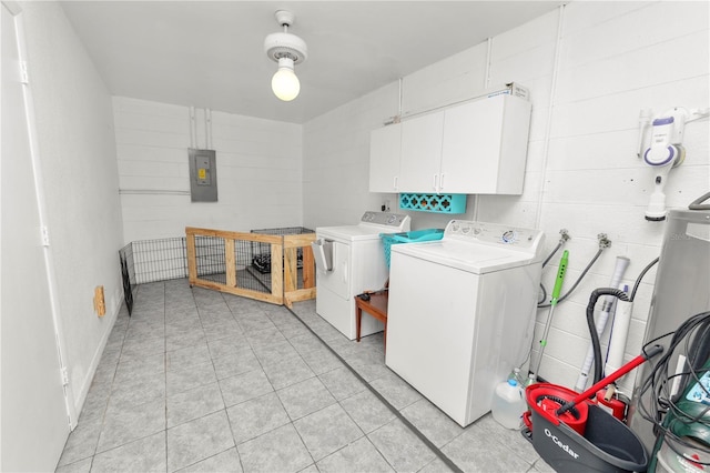 laundry area with washing machine and clothes dryer, electric panel, and cabinets