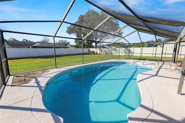 view of pool featuring glass enclosure, a patio area, and a yard