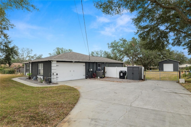 ranch-style house featuring a storage unit and a front yard