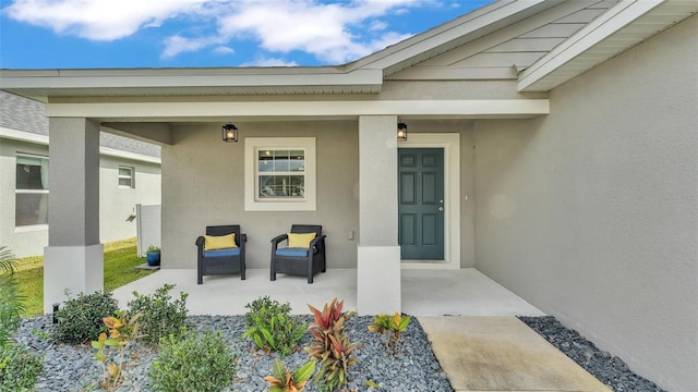 doorway to property featuring covered porch