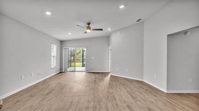 empty room with vaulted ceiling, light hardwood / wood-style flooring, and ceiling fan