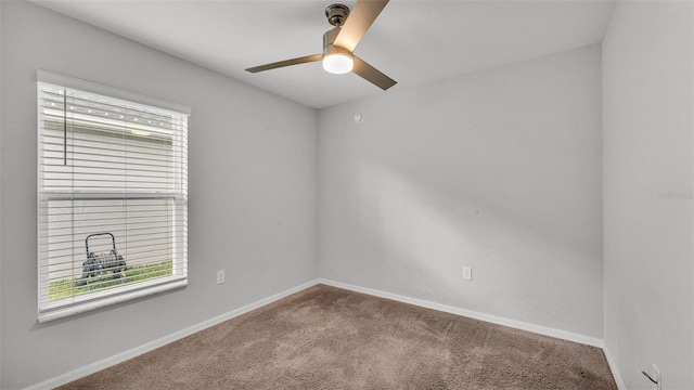 spare room featuring carpet flooring and ceiling fan