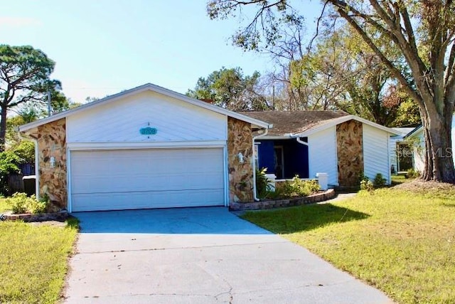 ranch-style home featuring a front lawn and a garage