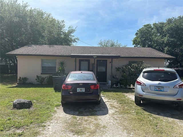 single story home with a front yard