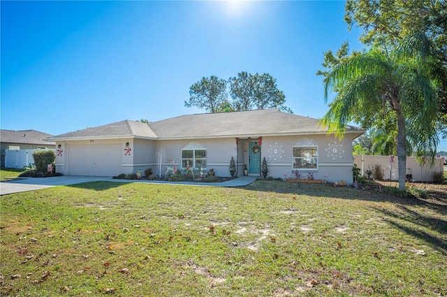 ranch-style home with a front yard and a garage