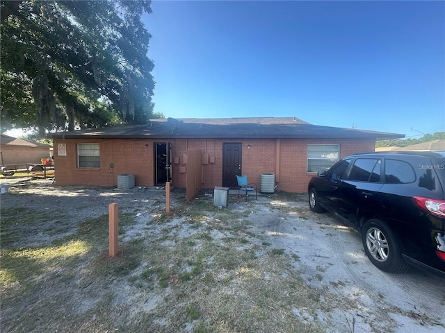 back of property with central air condition unit