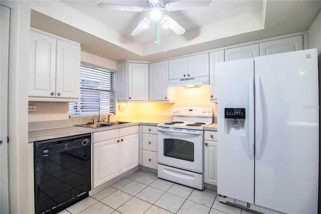 kitchen with white cabinets, a raised ceiling, white appliances, and sink