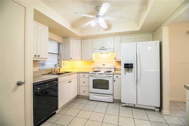 kitchen featuring ceiling fan, sink, a raised ceiling, white appliances, and white cabinets