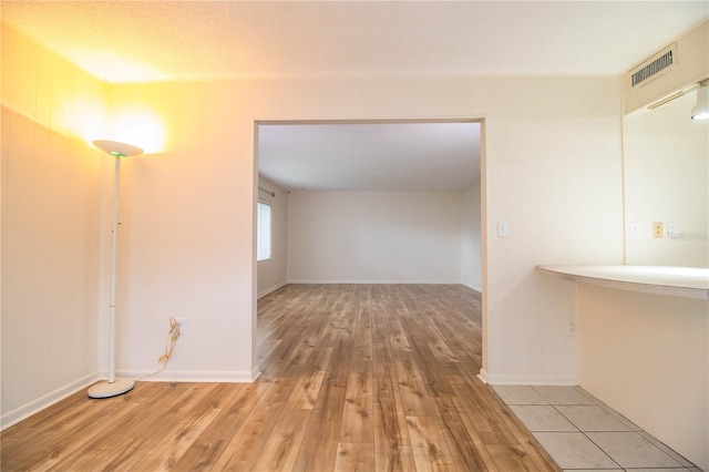 hall with light hardwood / wood-style floors