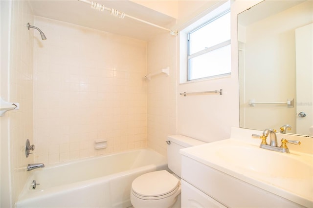 full bathroom featuring vanity, toilet, and tiled shower / bath