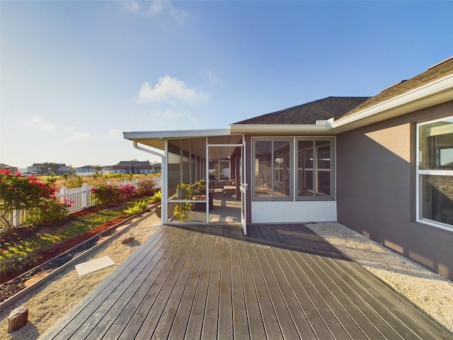 wooden terrace featuring a sunroom