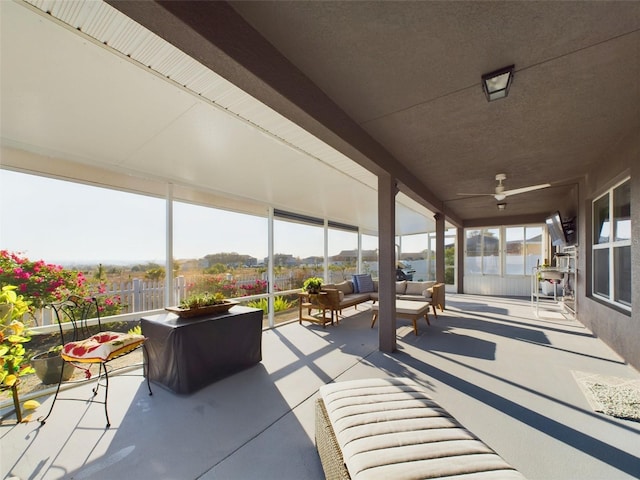 view of patio with outdoor lounge area and ceiling fan