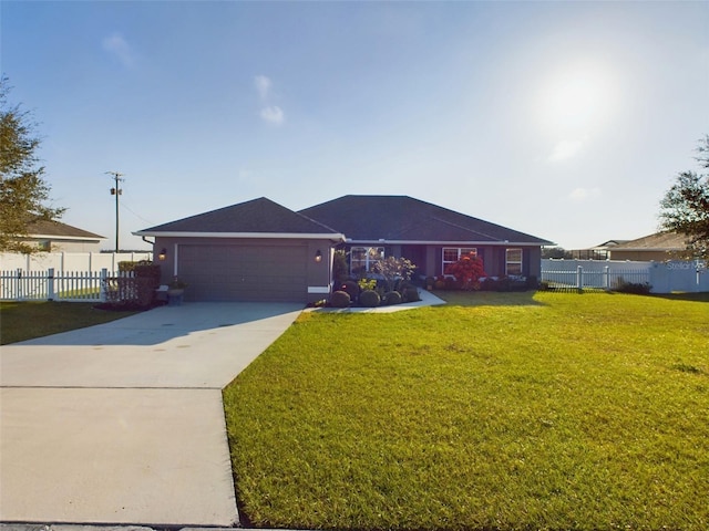 ranch-style house with a garage and a front lawn