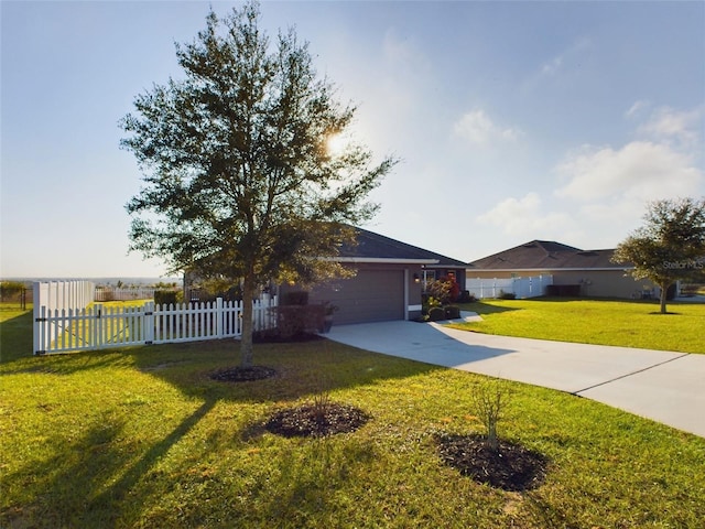 view of front of house with a garage and a front yard