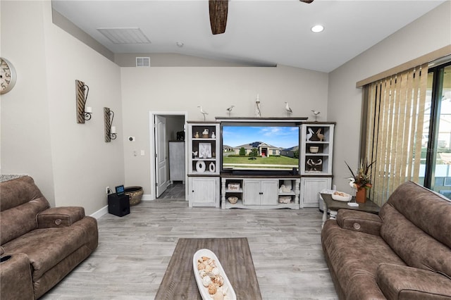 living room featuring ceiling fan, light hardwood / wood-style floors, and vaulted ceiling